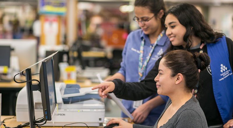 staff assisting student