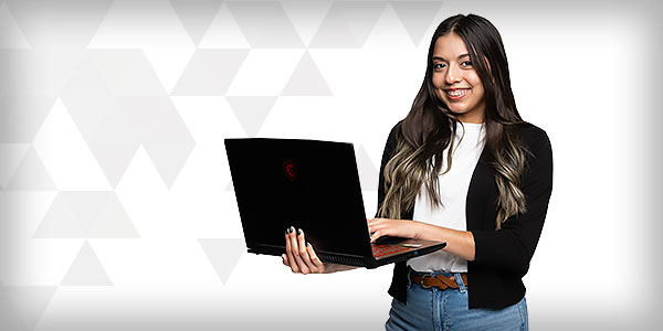 student holding laptop
